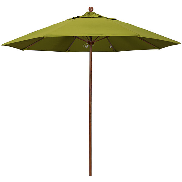A green California Umbrella with a brown wooden pole.