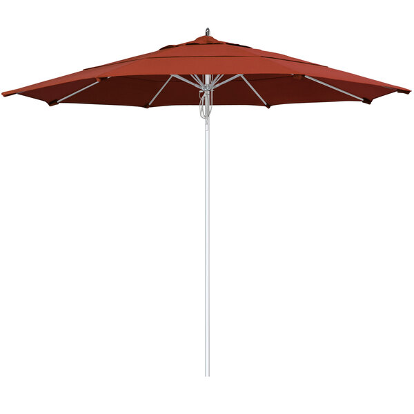 A close-up of a red California Umbrella with a silver pole and terracotta fabric.