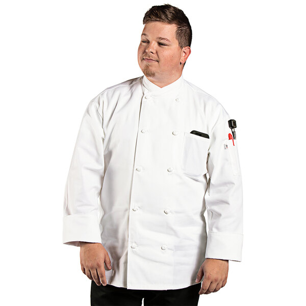 A man in a white Uncommon Chef long sleeve chef coat.