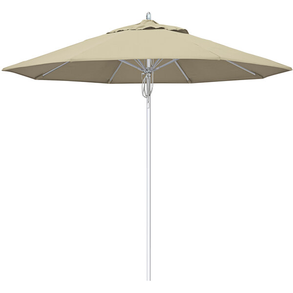 A close-up of a beige California Umbrella with Sunbrella fabric.
