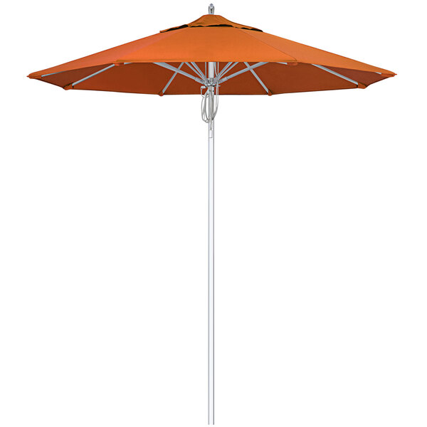 A Tuscan fabric California Umbrella with a silver pole and orange canopy.