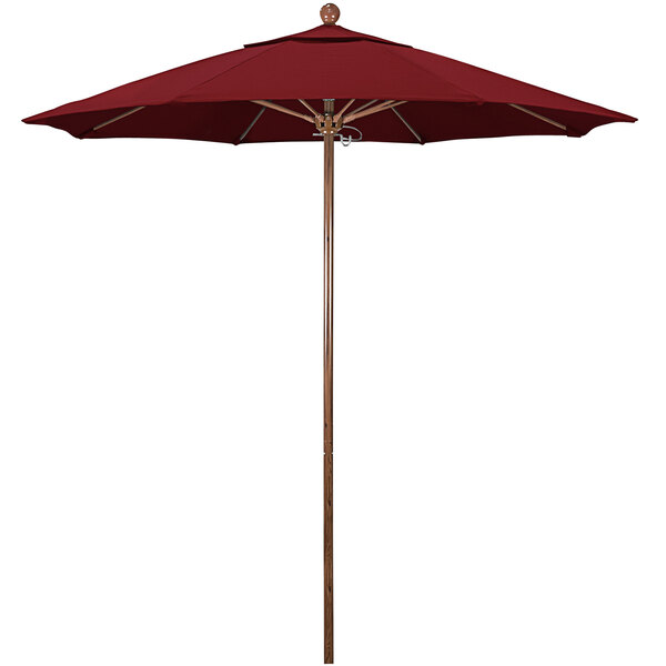 A close-up of a red California Umbrella with a wooden pole.