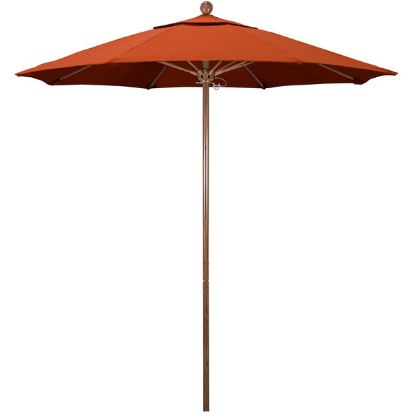 A California Umbrella Venture Series outdoor table umbrella with an orange canopy and American Oak pole.
