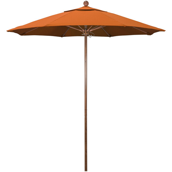 A California Umbrella orange outdoor umbrella with a wooden pole on a white background.