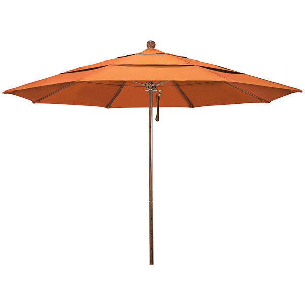 A melon orange California Umbrella with a wooden pole.