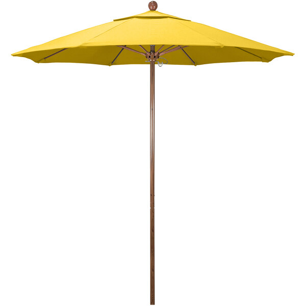 A California Umbrella yellow outdoor umbrella with American oak pole.