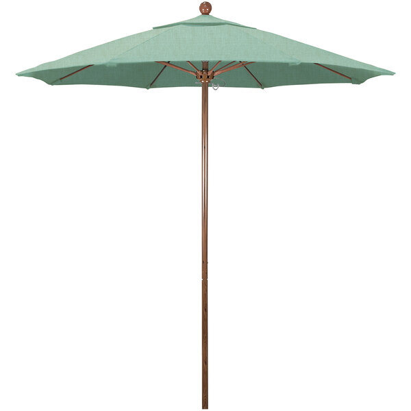 A close-up of a green California Umbrella with a wooden pole.