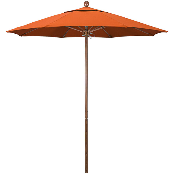An orange umbrella with an American Oak pole and Sunbrella canopy.