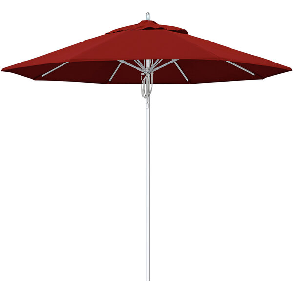 A close-up of a red California Umbrella with a silver pole and Jockey Red Sunbrella canopy.