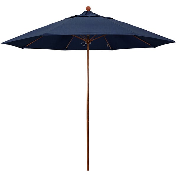 A close-up of a California Umbrella with a blue Sunbrella canopy and an American Oak pole.