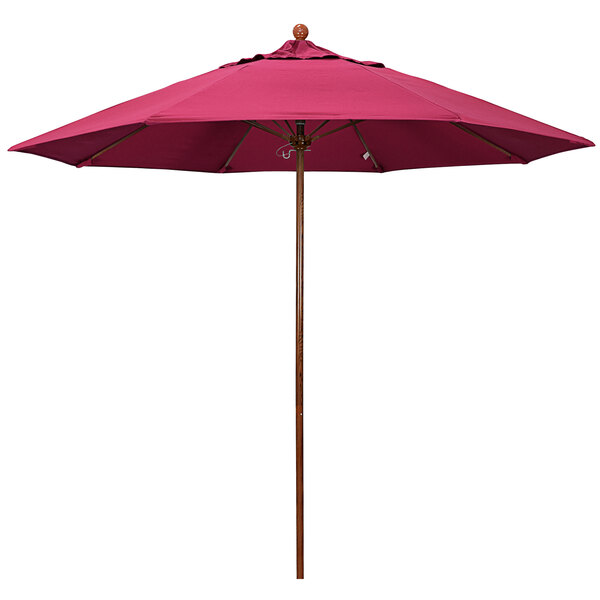 A close-up of a hot pink California Umbrella with an American Oak pole.