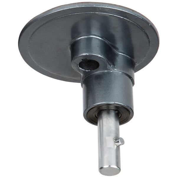 A round metal object with a round disc on top.