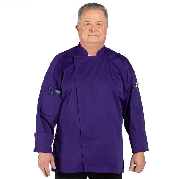 A man wearing a grape purple Uncommon Chef long sleeve chef coat with mesh back.