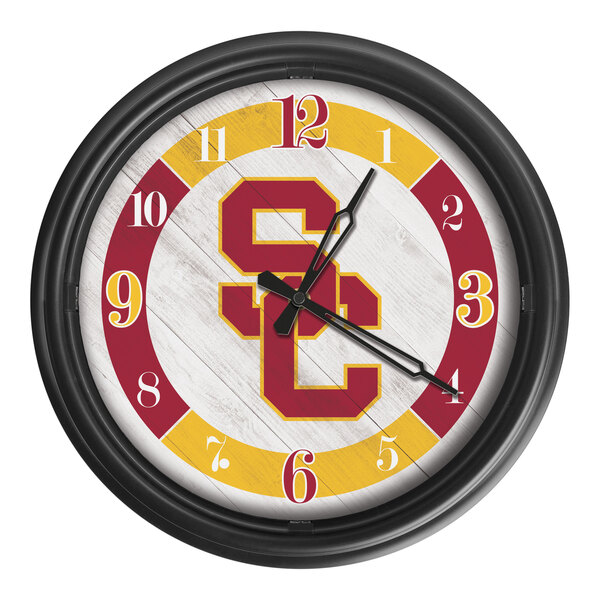 A white Holland Bar Stool wall clock with the University of Southern California Trojans logo on it.