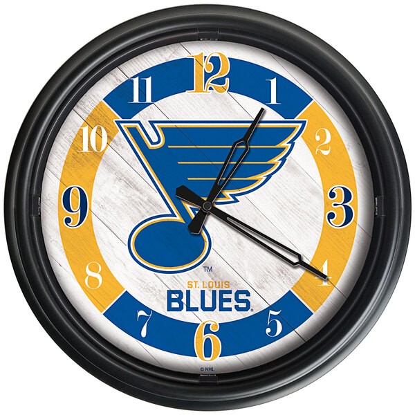 A Holland Bar Stool St. Louis Blues wall clock with a logo on it.