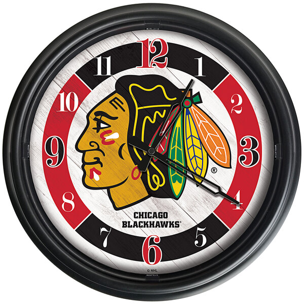 A Holland Bar Stool Chicago Blackhawks wall clock with LED numbers and team logo.