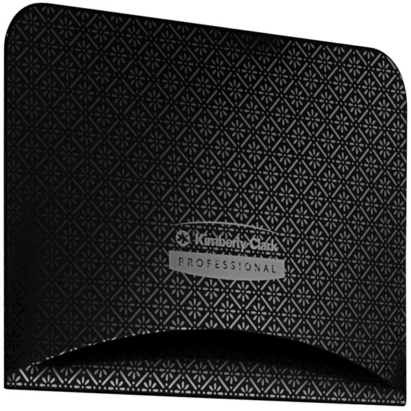 A black and white patterned rectangular faceplate with a black and silver rectangular object.
