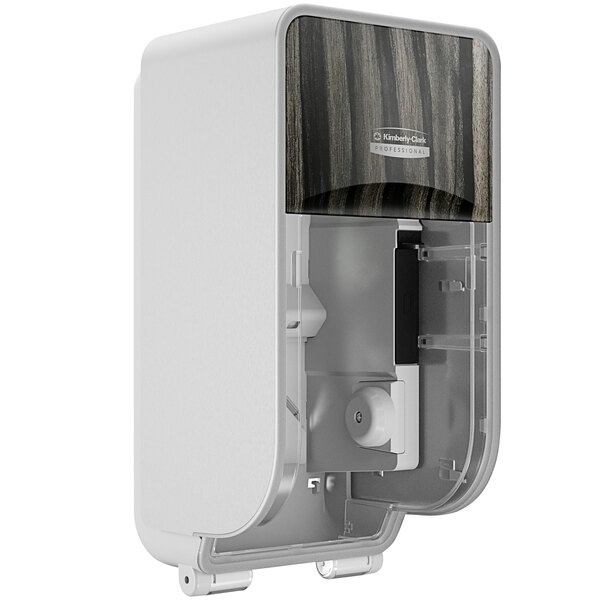 A white Kimberly-Clark Professional ICON Coreless Standard Roll toilet paper dispenser with a black and wood design.