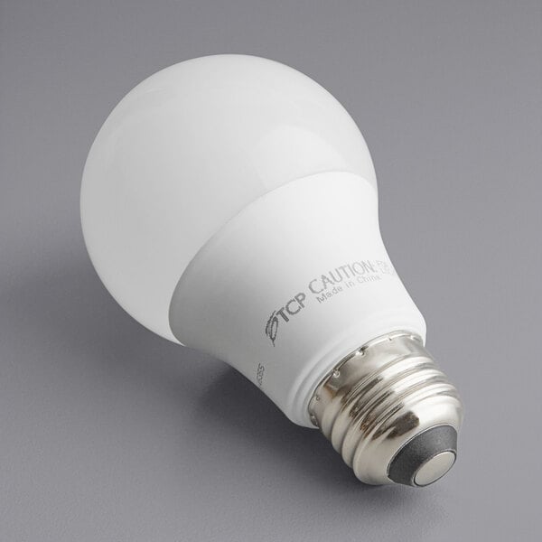 A TCP dimmable LED light bulb with white casing and a white interior.