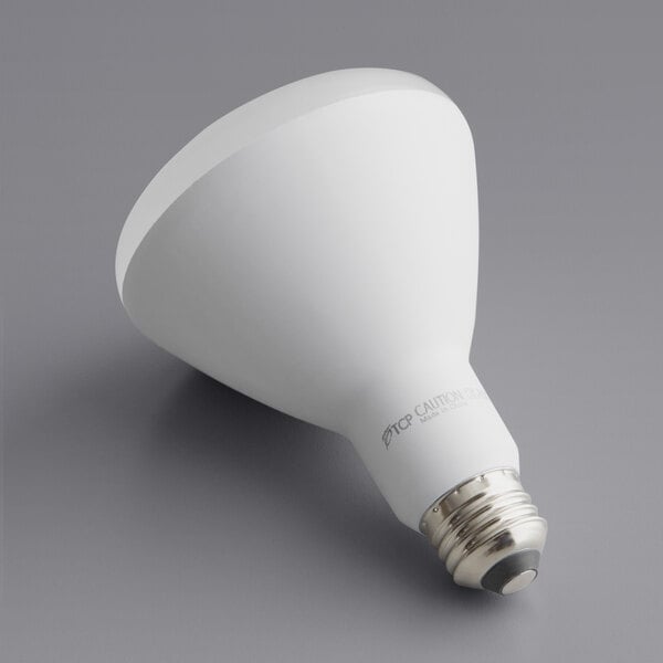 A TCP Elite dimmable LED light bulb with a white base and white glass.