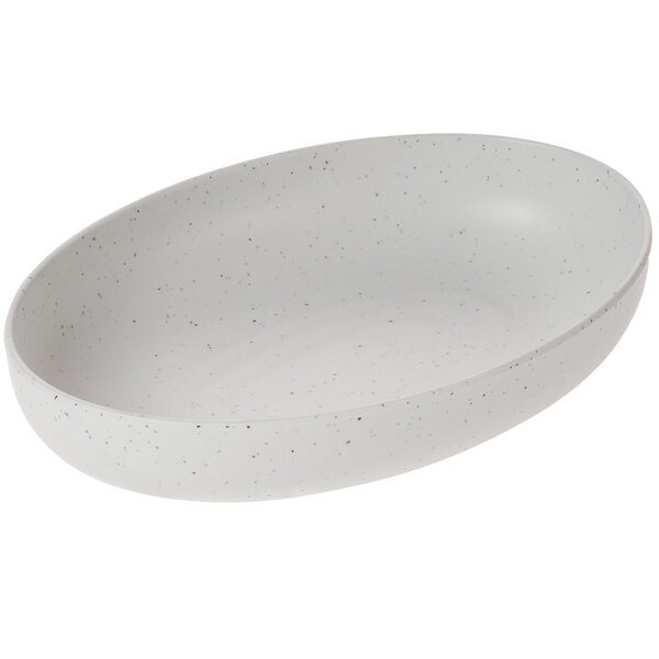 A white oval dish with speckled specks.