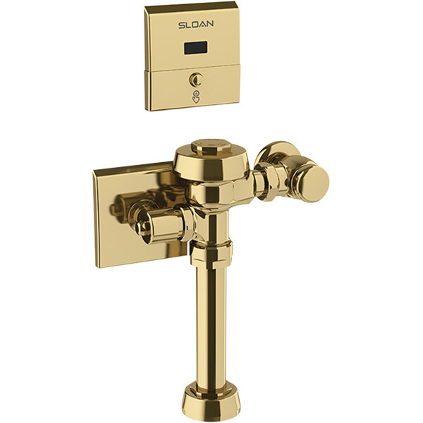 A gold metal Sloan Royal hardwired water closet flushometer.