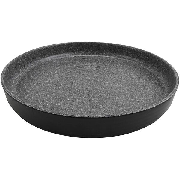 A round black melamine platter with a raised rim.