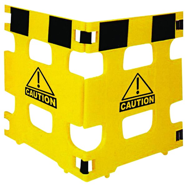 A yellow polyethylene barrier with black "Caution" text on two panels.