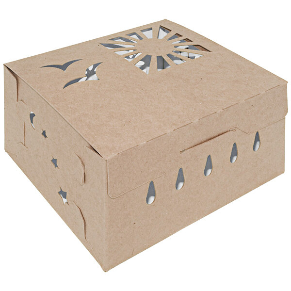 A brown cardboard box with cut out designs.