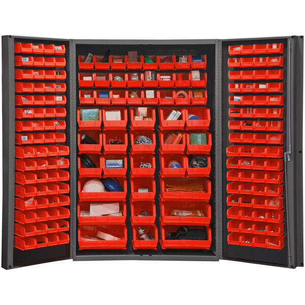 A Durham storage cabinet with red bins on shelves inside.