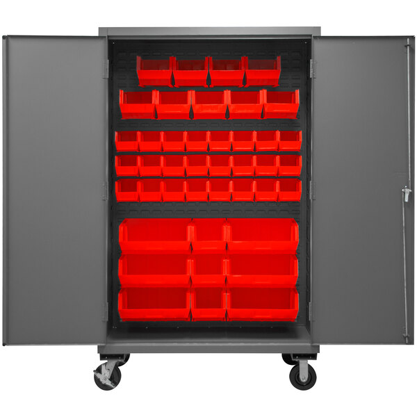 A large metal Durham storage cabinet with red bins inside.