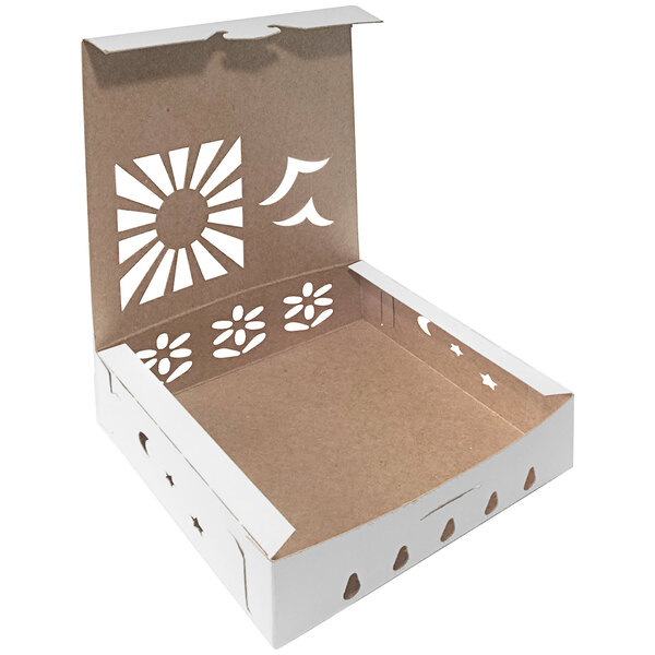 A white cardboard box with a cut out design of a sun and flowers.
