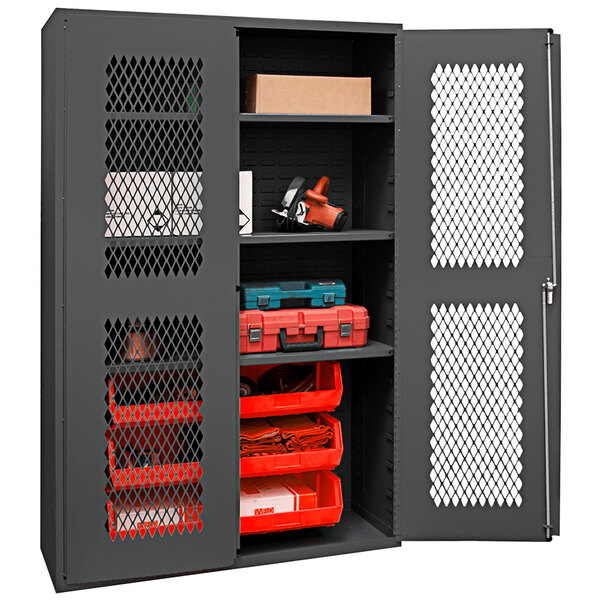 A grey metal Durham storage cabinet with red bins on shelves.