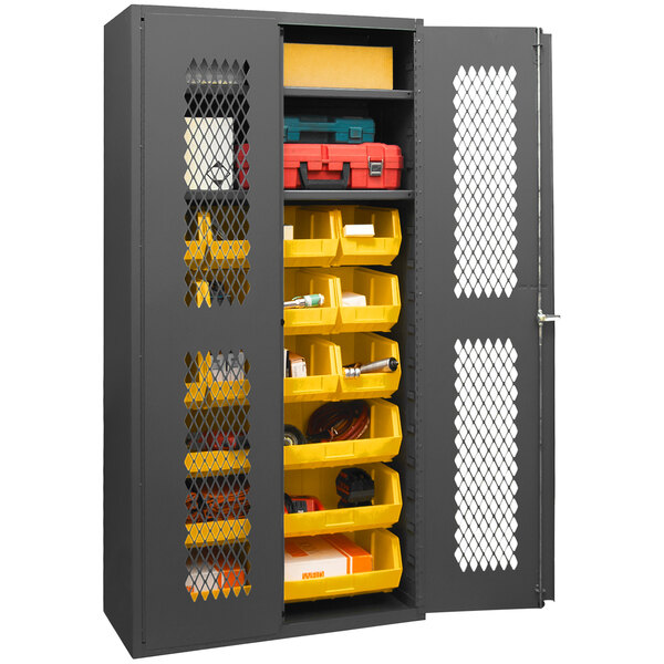A metal Durham storage cabinet with yellow bins on shelves.