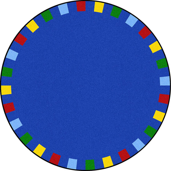 A round blue rug with colorful squares on it.