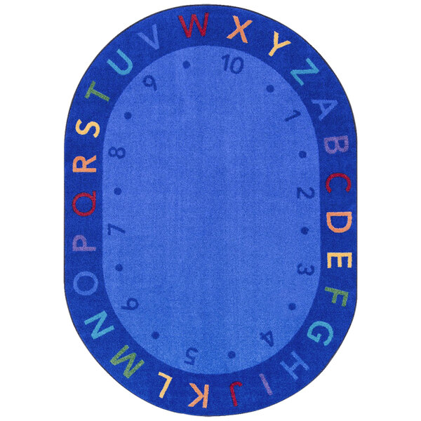 A multicolored oval area rug with letters and numbers in blue.