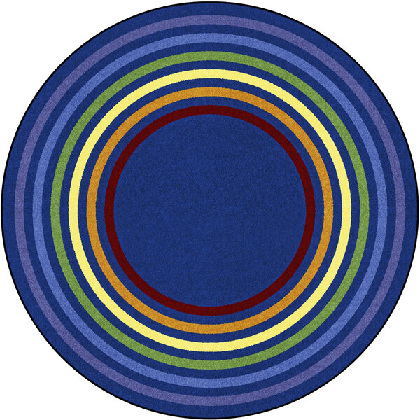 A Joy Carpets multicolored circular area rug with rings of different colors.