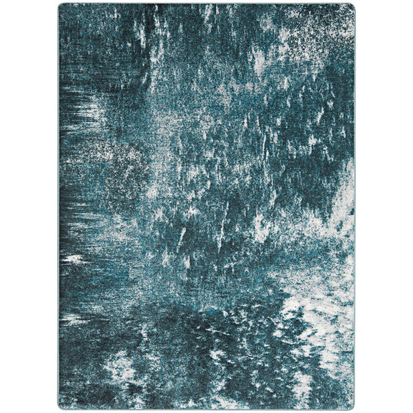 A close up of a blue and white Joy Carpets rectangular area rug with a watery effect.