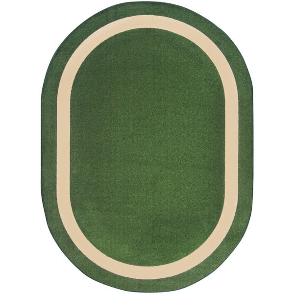 A green and white oval area rug with a white border.