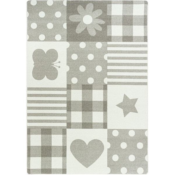 A Joy Carpets area rug with a grey and white patchwork design including a butterfly, star, and flower.