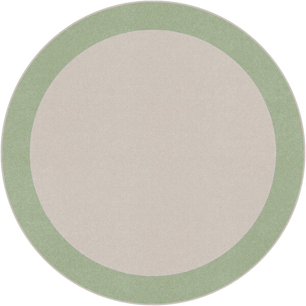 A white circular rug with a green border.