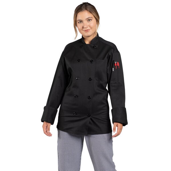 A woman wearing a black Uncommon Chef long sleeve chef coat with mesh back.
