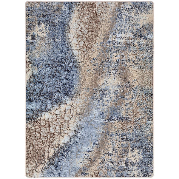 A close up of a blue and beige Joy Carpets Solitude rectangular area rug with a pattern.