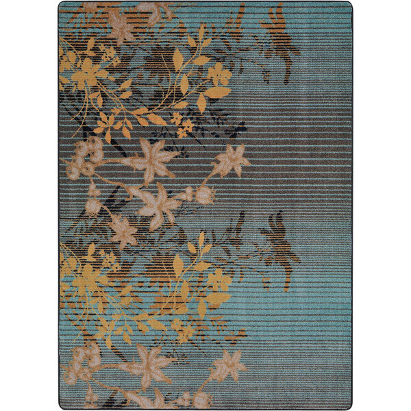 A Joy Carpets rug with blue and yellow flowers on a lagoon background.