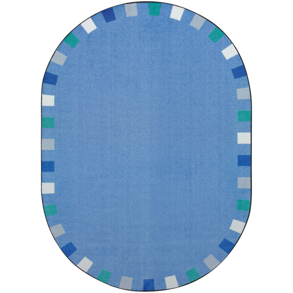 A blue oval rug with a white and blue border.