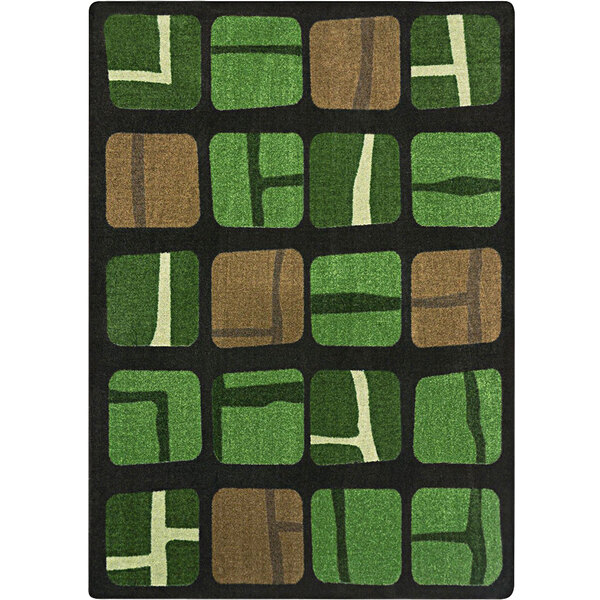 A close-up of a Joy Carpets Meadow area rug with green and brown squares.