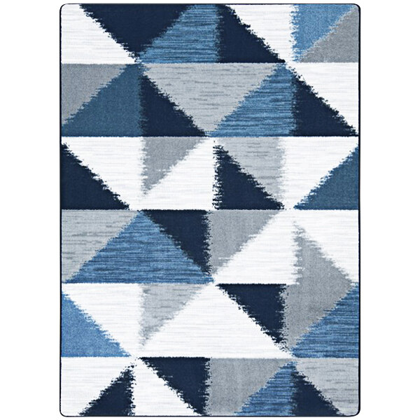 A close up of a Joy Carpets rectangular area rug with blue and grey triangles.