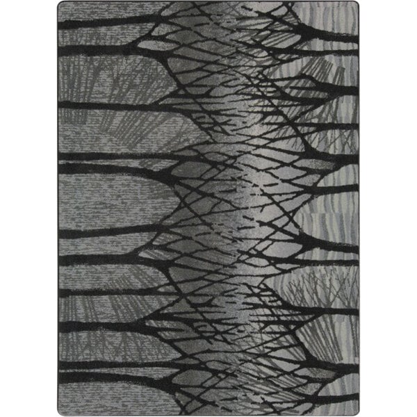 A Joy Carpets rectangular area rug with gray trees on a fog background.