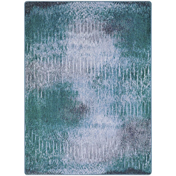 A close-up of a Joy Carpets Mirage Lake area rug with a green and blue pattern.