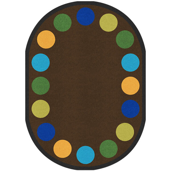 An earthtone oval area rug with colorful circles.